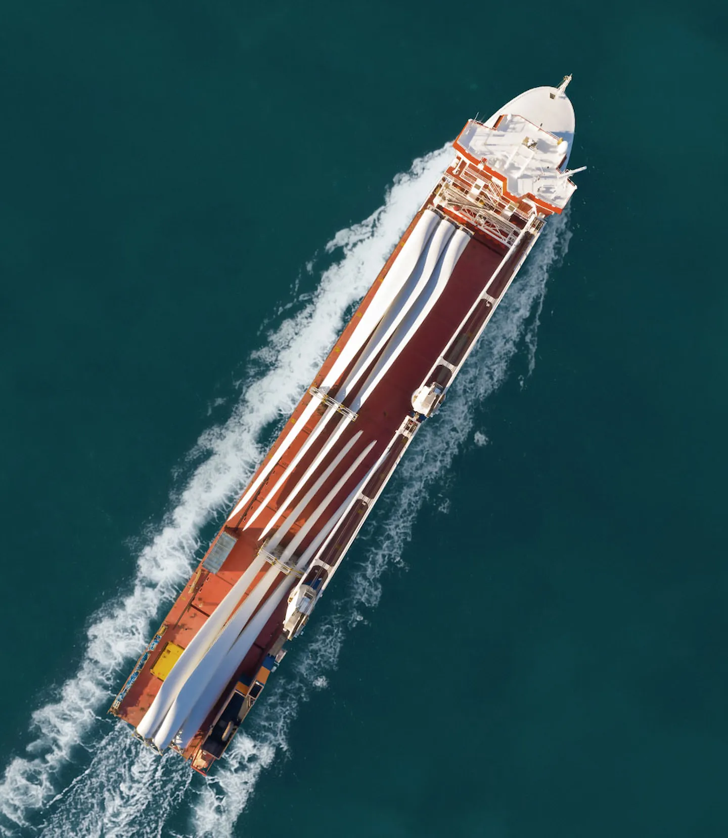 Marine vessel transporting wind turbine blades
